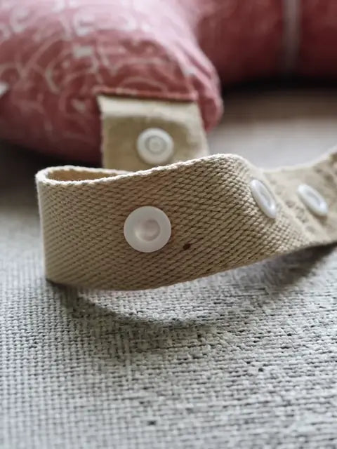 Close-up of the waist strap snapping on and buckling