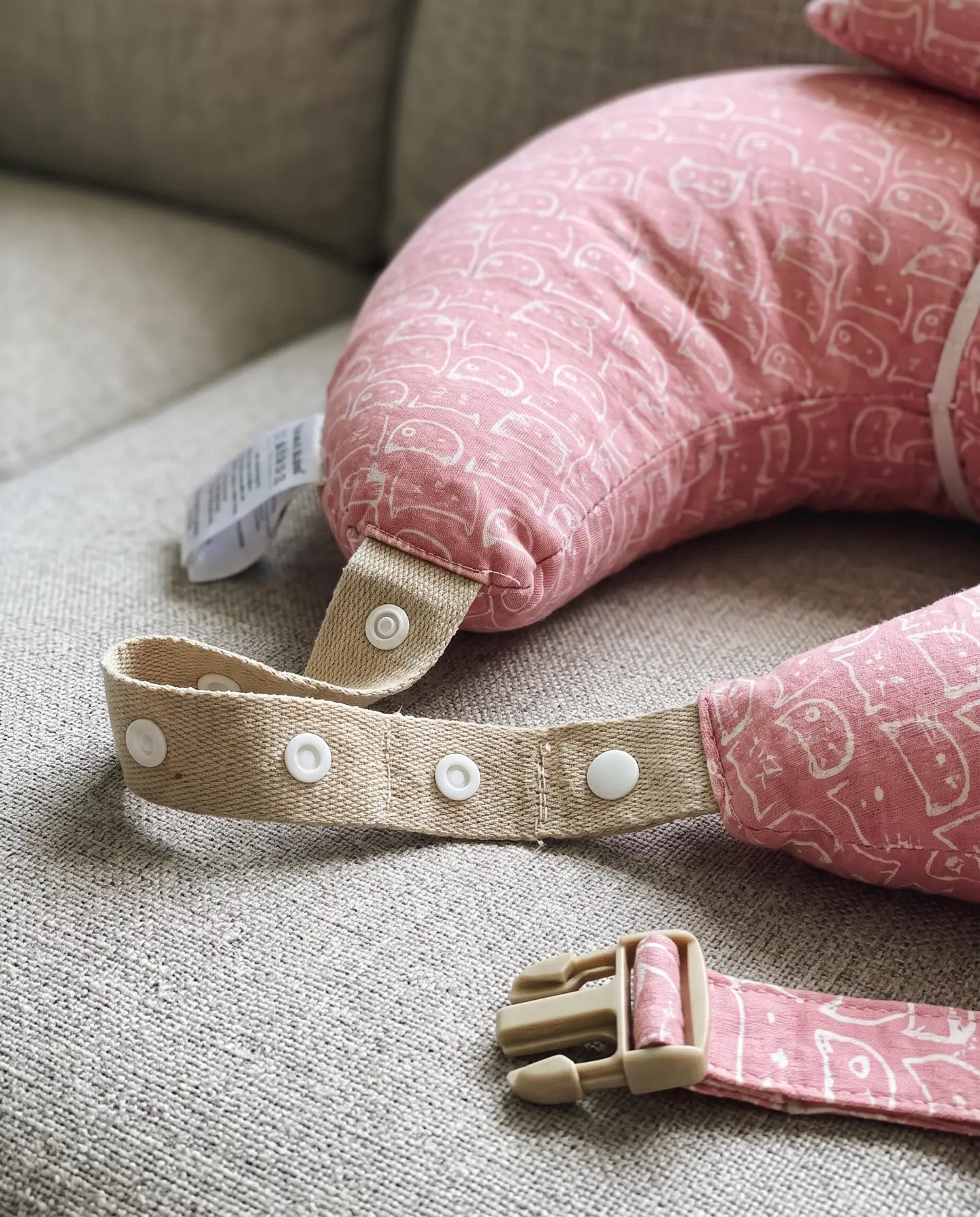 Close-up of the waist strap, snaps and buckle