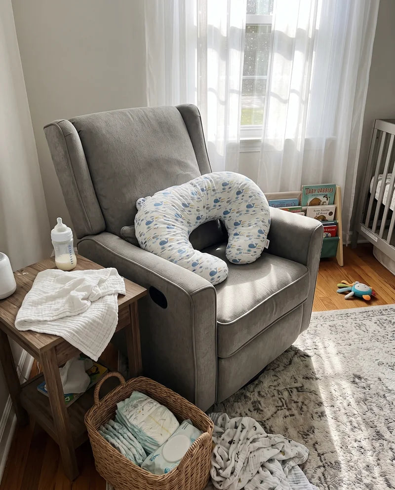 The pillow resting on a nursery armchair